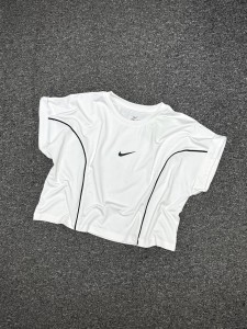 كراپ ورزشي زنانه استين كوتاه پاكتي NIKE